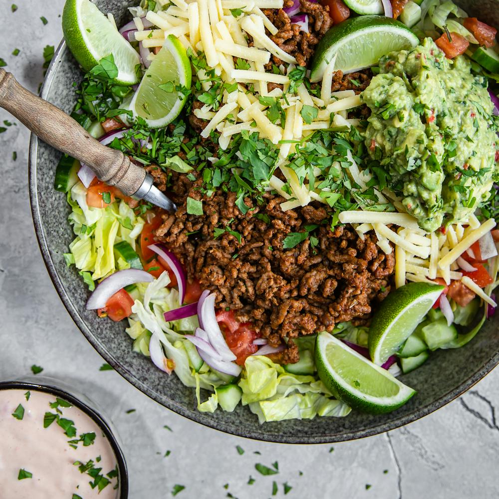 Cover image of “Keto taco salad with salsa dressing and guacamole”